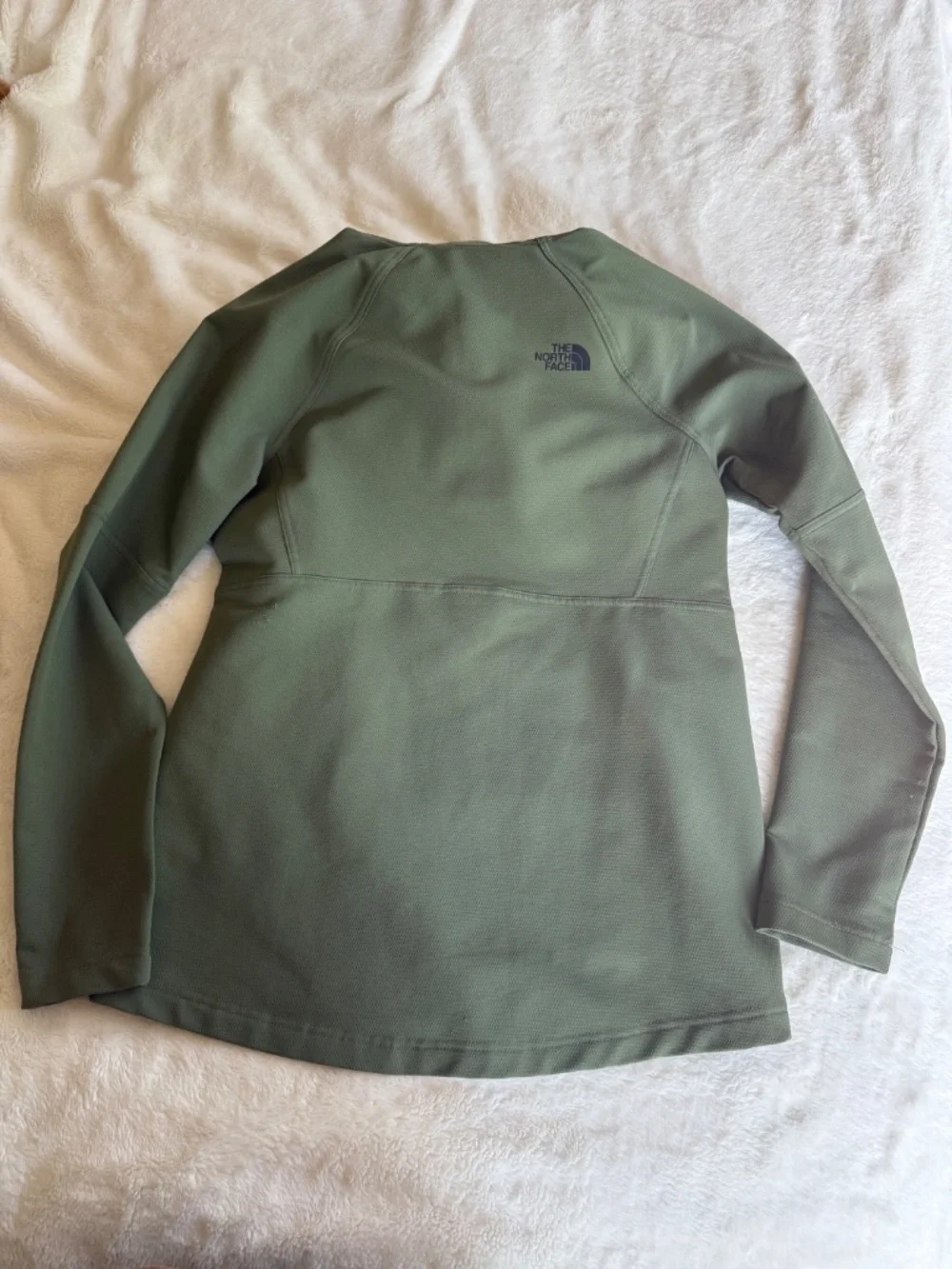 olive green The North Face Tekno Ridge Hoodie features a kangaroo pocket